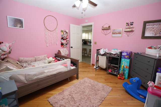 bedroom featuring ceiling fan and hardwood / wood-style flooring