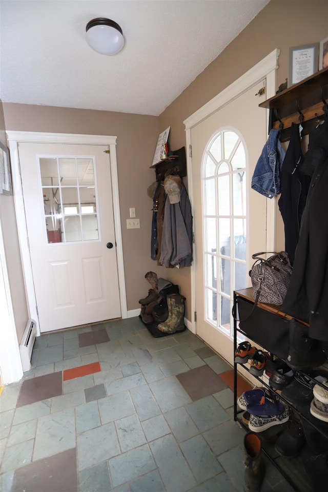 mudroom featuring a baseboard heating unit