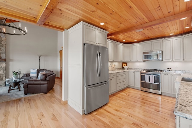 kitchen featuring light stone countertops, stainless steel appliances, light hardwood / wood-style floors, and beamed ceiling