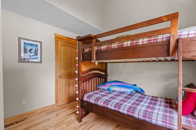 bedroom with light hardwood / wood-style flooring