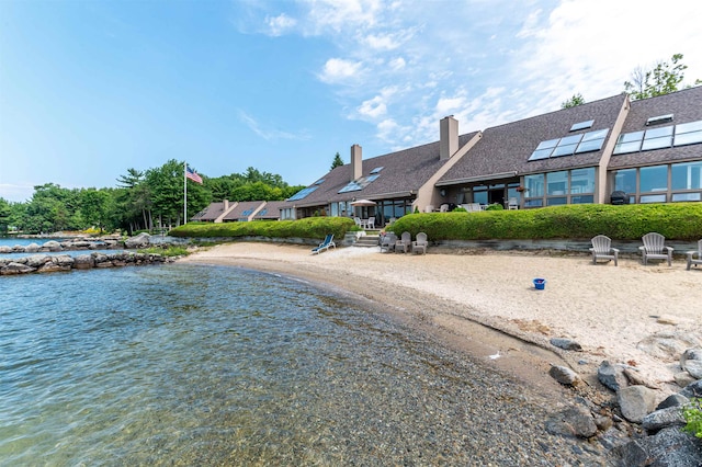 exterior space with a water view