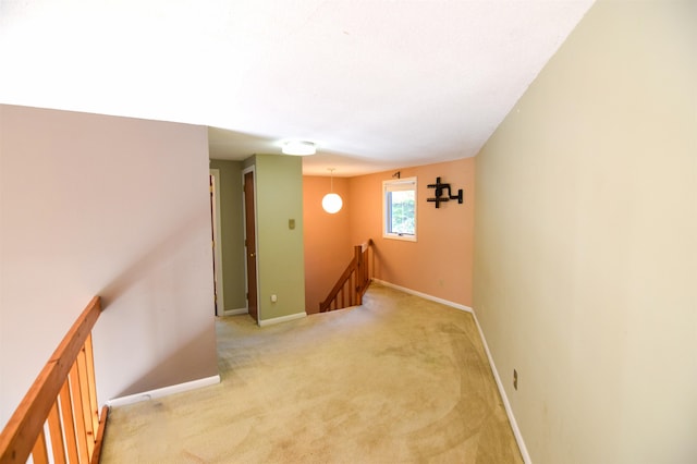 hallway with light colored carpet