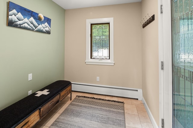 interior space with light tile patterned floors and a baseboard radiator