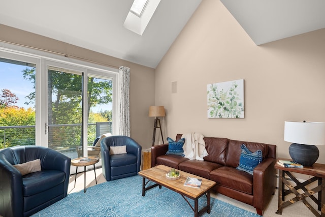 living room with a skylight and high vaulted ceiling