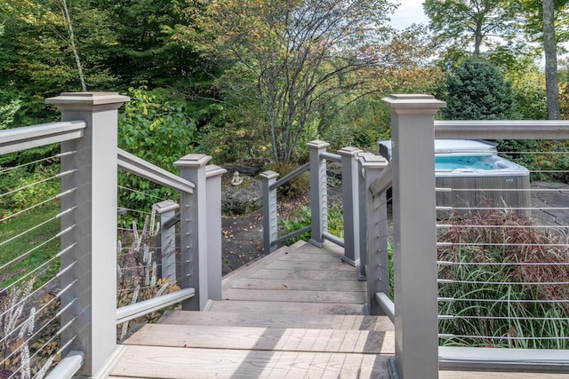 view of gate with a pool