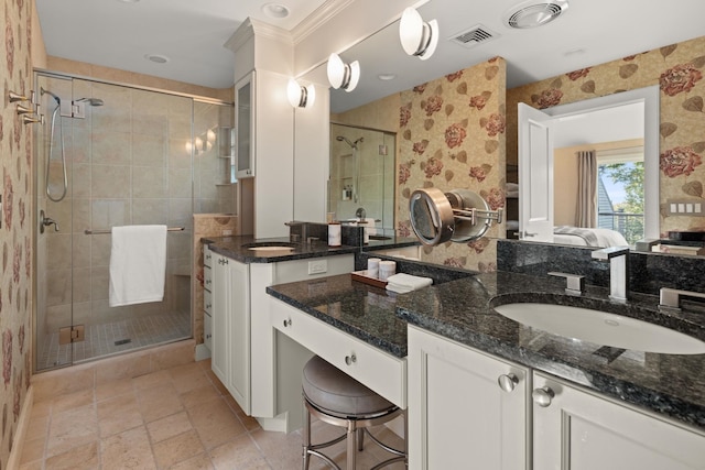 bathroom with vanity and a shower with shower door