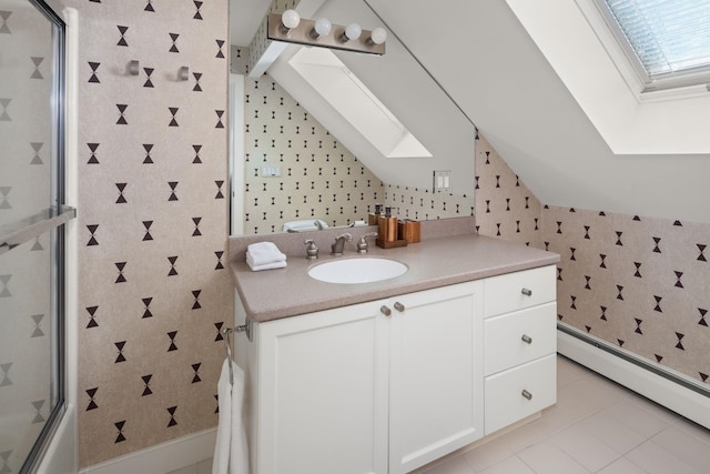 bathroom with combined bath / shower with glass door, vanity, a baseboard radiator, and vaulted ceiling with skylight