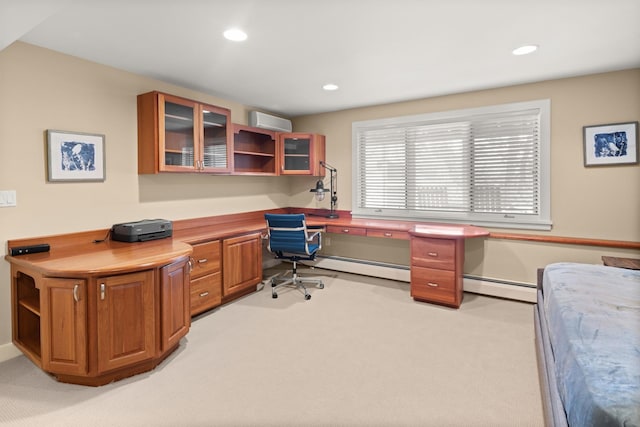 carpeted home office with a wall unit AC and built in desk