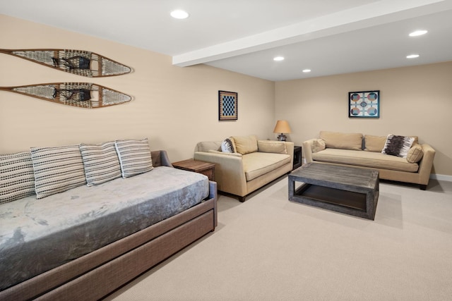 living room with beamed ceiling and light colored carpet