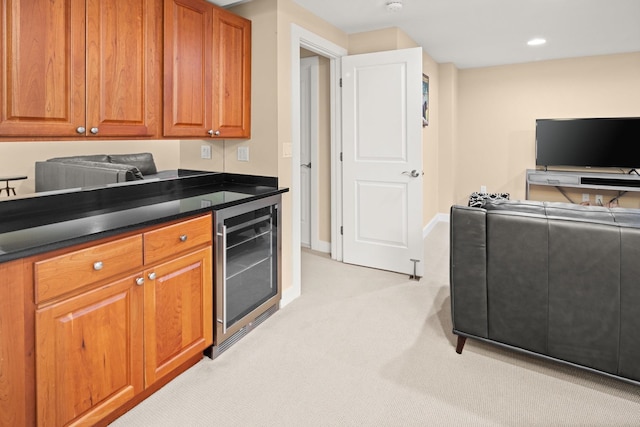 kitchen with light carpet and wine cooler