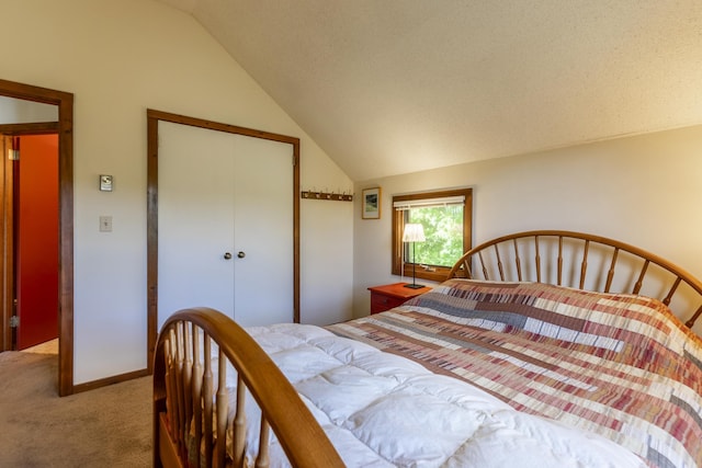 27 Lawrence Hill Rd Unit 5, Weston, VT 05161 - carpeted bedroom with vaulted ceiling and a closet