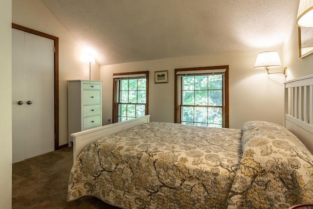 27 Lawrence Hill Rd Unit 5, Weston, VT 05161 - carpeted bedroom with lofted ceiling and a textured ceiling