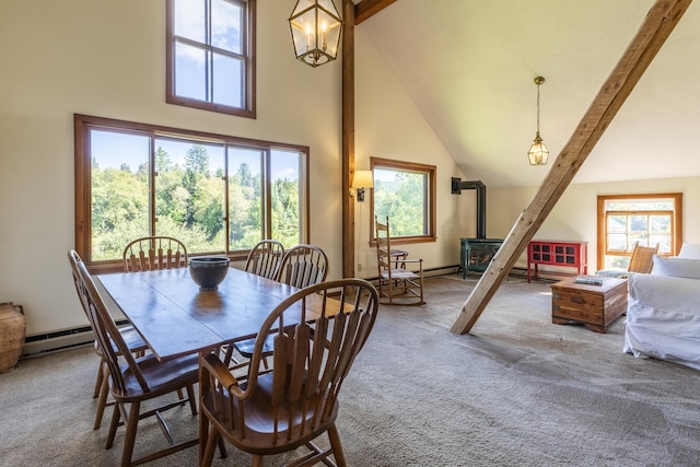 27 Lawrence Hill Rd Unit 5, Weston, VT 05161 - carpeted dining area featuring a wood stove, high vaulted ceiling, healthy amount of natural light, baseboard heating, and beam ceiling