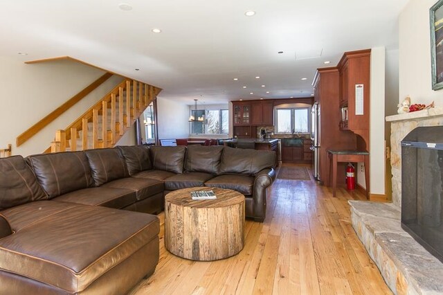 living room featuring a fireplace and light hardwood / wood-style floors