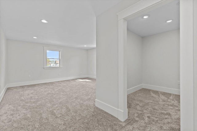 below grade area featuring carpet floors, baseboards, and recessed lighting