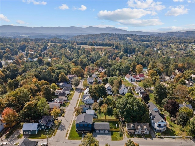 birds eye view of property with a residential view, a mountain view, and a forest view