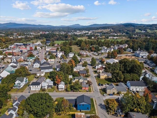 drone / aerial view featuring a residential view and a mountain view