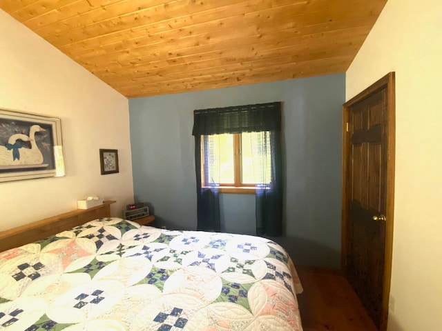 bedroom featuring wood-type flooring, lofted ceiling, and wood ceiling