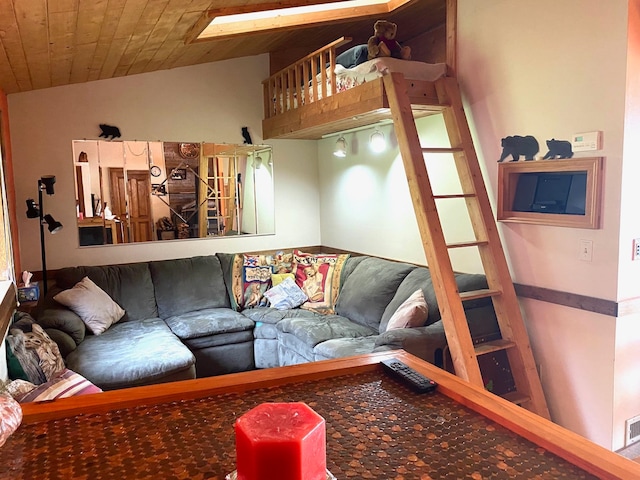 living room with vaulted ceiling and wooden ceiling