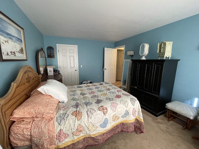 bedroom featuring light colored carpet