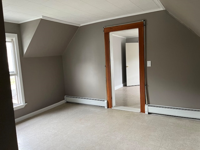 bonus room featuring lofted ceiling and a baseboard heating unit