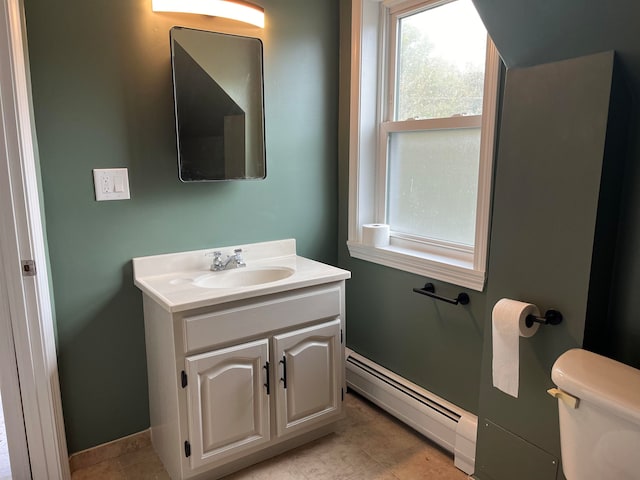 bathroom featuring a baseboard radiator, vanity, and toilet