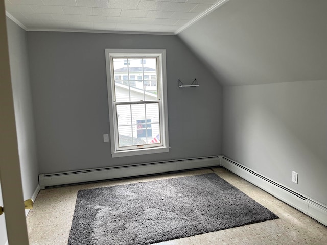 bonus room featuring baseboard heating and lofted ceiling