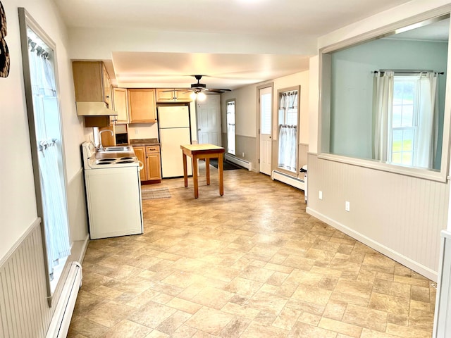 kitchen featuring ceiling fan, a baseboard radiator, white appliances, and a healthy amount of sunlight