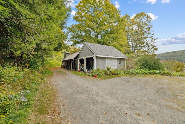 view of side of property with an outbuilding