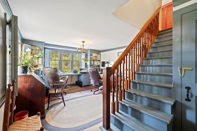 interior space with an inviting chandelier and ornamental molding