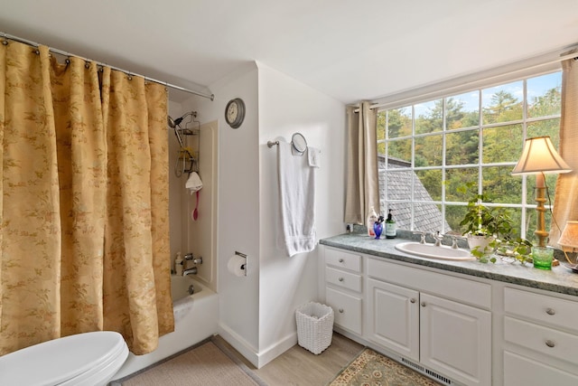 full bathroom with shower / bath combo, vanity, toilet, and hardwood / wood-style flooring