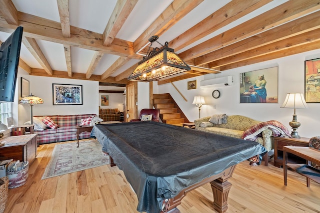 game room with beamed ceiling, light hardwood / wood-style floors, pool table, and a wall unit AC