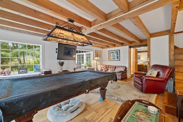 game room with beam ceiling, a wealth of natural light, pool table, and hardwood / wood-style floors