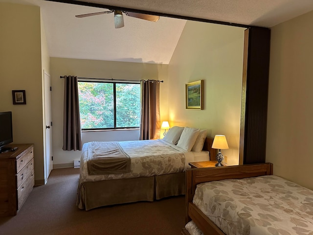 bedroom with vaulted ceiling, ceiling fan, carpet floors, and a textured ceiling