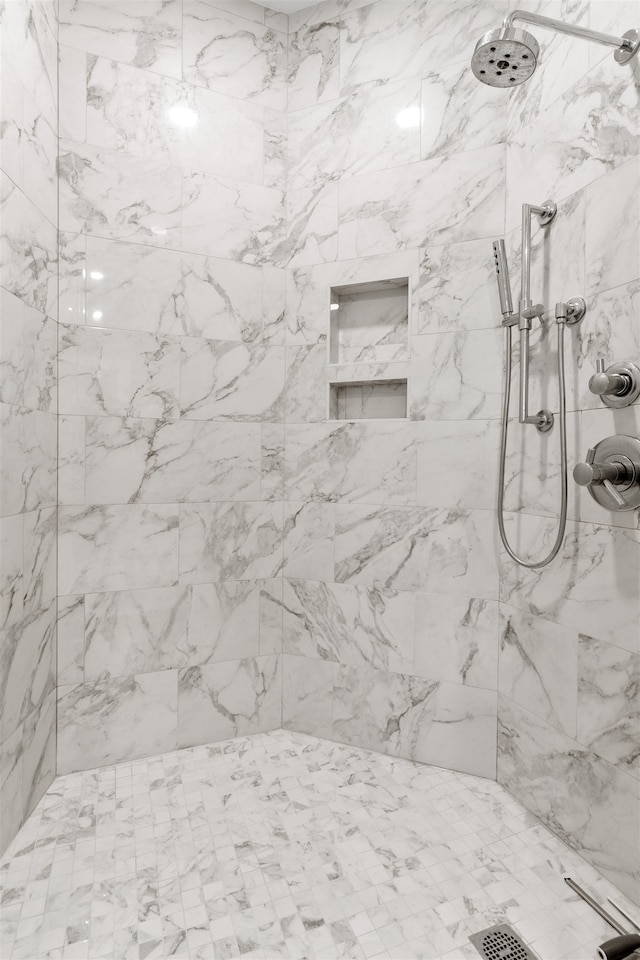 bathroom featuring tiled shower