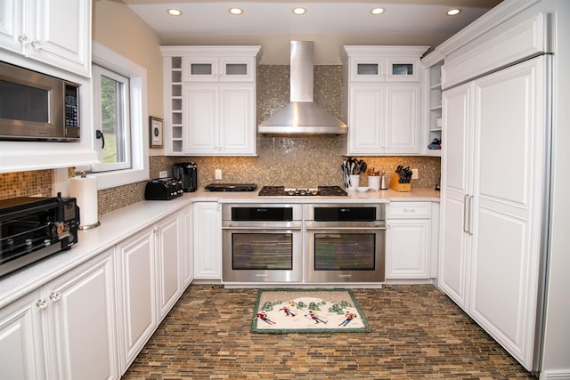 226 Okemo Trailside Ext Unit 47C, Ludlow, VT 05149 - kitchen with white cabinetry, open shelves, wall chimney exhaust hood, and stainless steel microwave