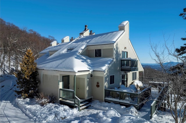 226 Okemo Trailside Ext Unit 47C, Ludlow, VT 05149 - snow covered property with a balcony and a chimney