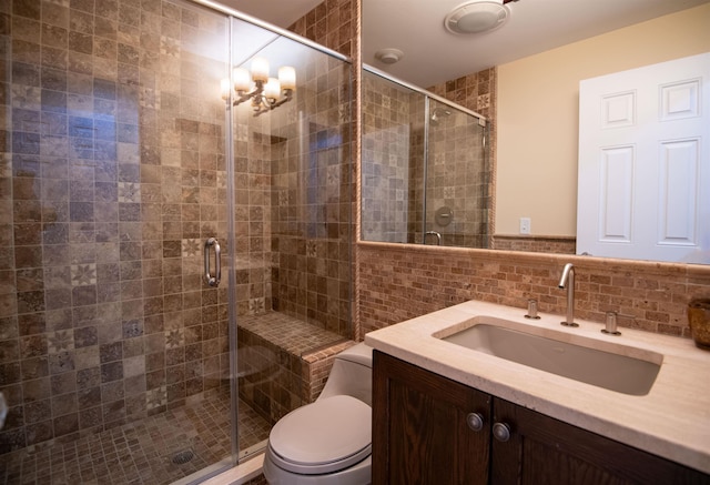 226 Okemo Trailside Ext Unit 47C, Ludlow, VT 05149 - full bathroom with vanity, toilet, a stall shower, and tile walls
