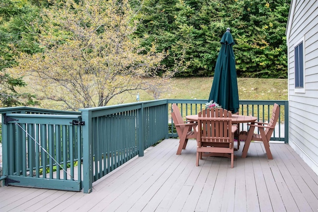 226 Okemo Trailside Ext Unit 47C, Ludlow, VT 05149 - wooden deck featuring outdoor dining space