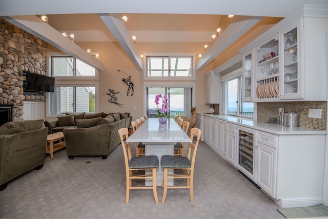 226 Okemo Trailside Ext Unit 47C, Ludlow, VT 05149 - dining space featuring beverage cooler, plenty of natural light, and carpet