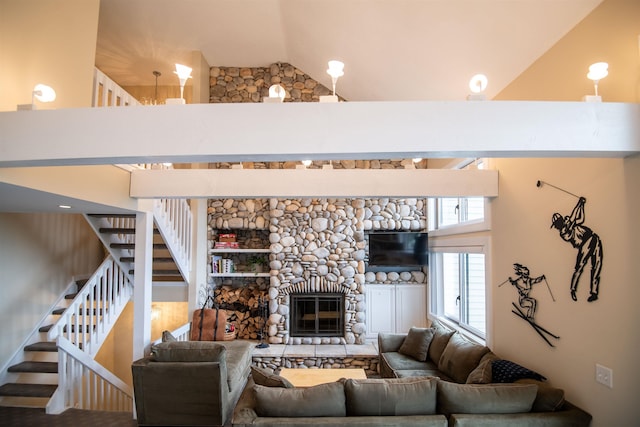 226 Okemo Trailside Ext Unit 47C, Ludlow, VT 05149 - living area with a fireplace, high vaulted ceiling, and stairs