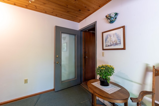 doorway to outside featuring wood ceiling and lofted ceiling