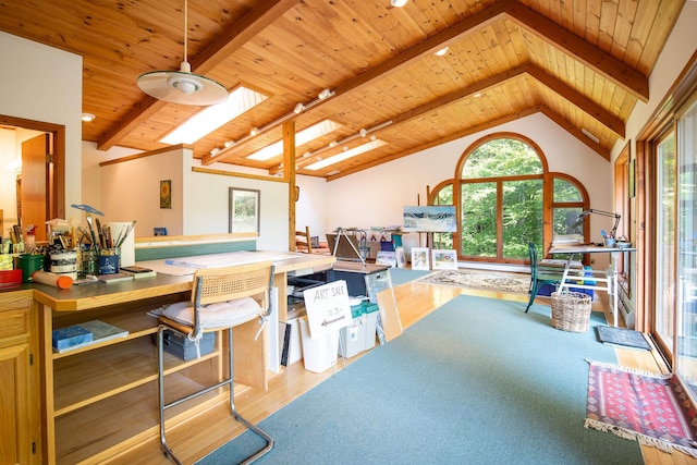 interior space with wood ceiling, light hardwood / wood-style floors, and lofted ceiling with skylight