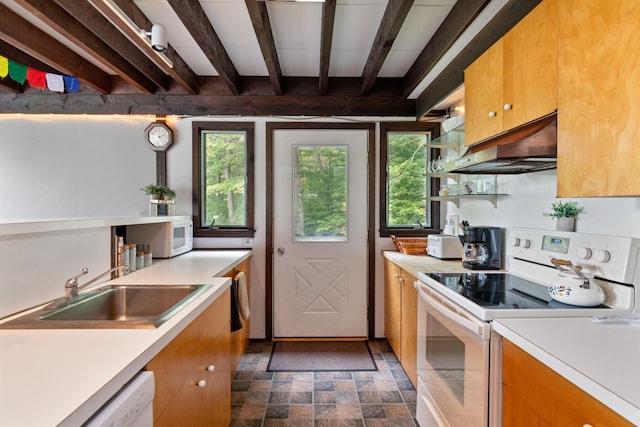 kitchen with white appliances, beam ceiling, and sink