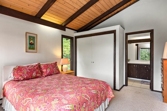 carpeted bedroom featuring multiple windows, lofted ceiling with beams, a closet, and wooden ceiling