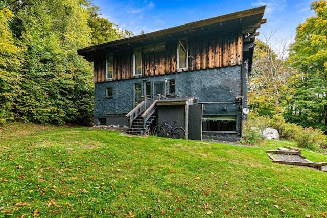 rear view of house with a lawn