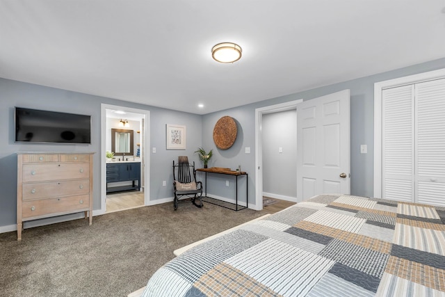 bedroom with connected bathroom, a closet, light colored carpet, and sink