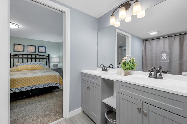 bathroom with walk in shower and vanity