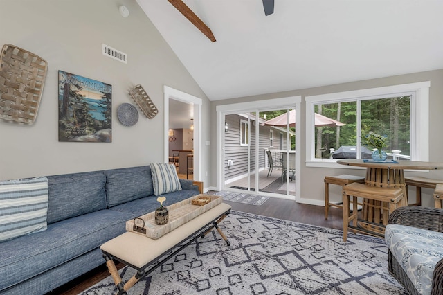 living room featuring wood-type flooring, high vaulted ceiling, and ceiling fan