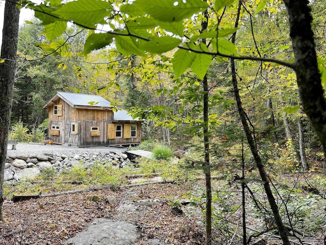 exterior space featuring a view of trees